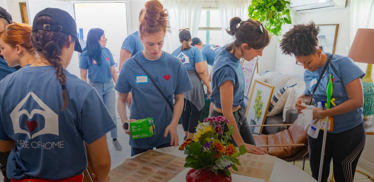 A Sense of Home volunteers preparing a new home together
